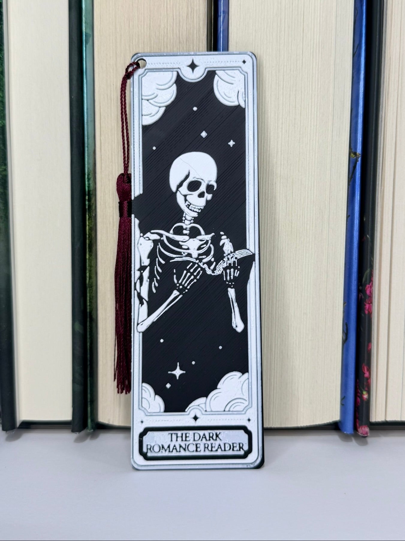 Bookmark with skeleton design and 'The Dark Romance Reader' text on a book.