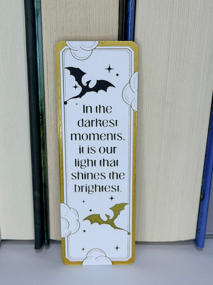 Decorative bookmark with bat illustrations and motivational quote on a plain background