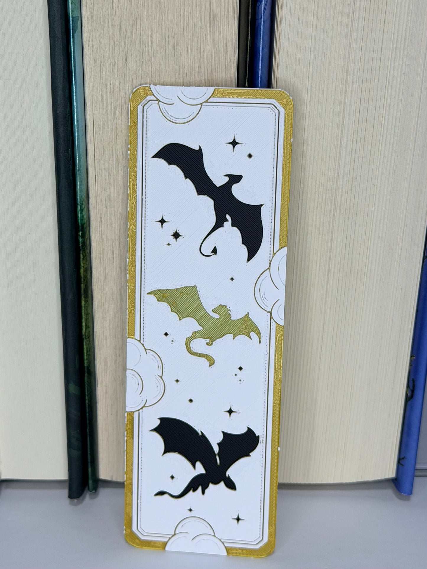 Bookmark with dragon designs on a book
